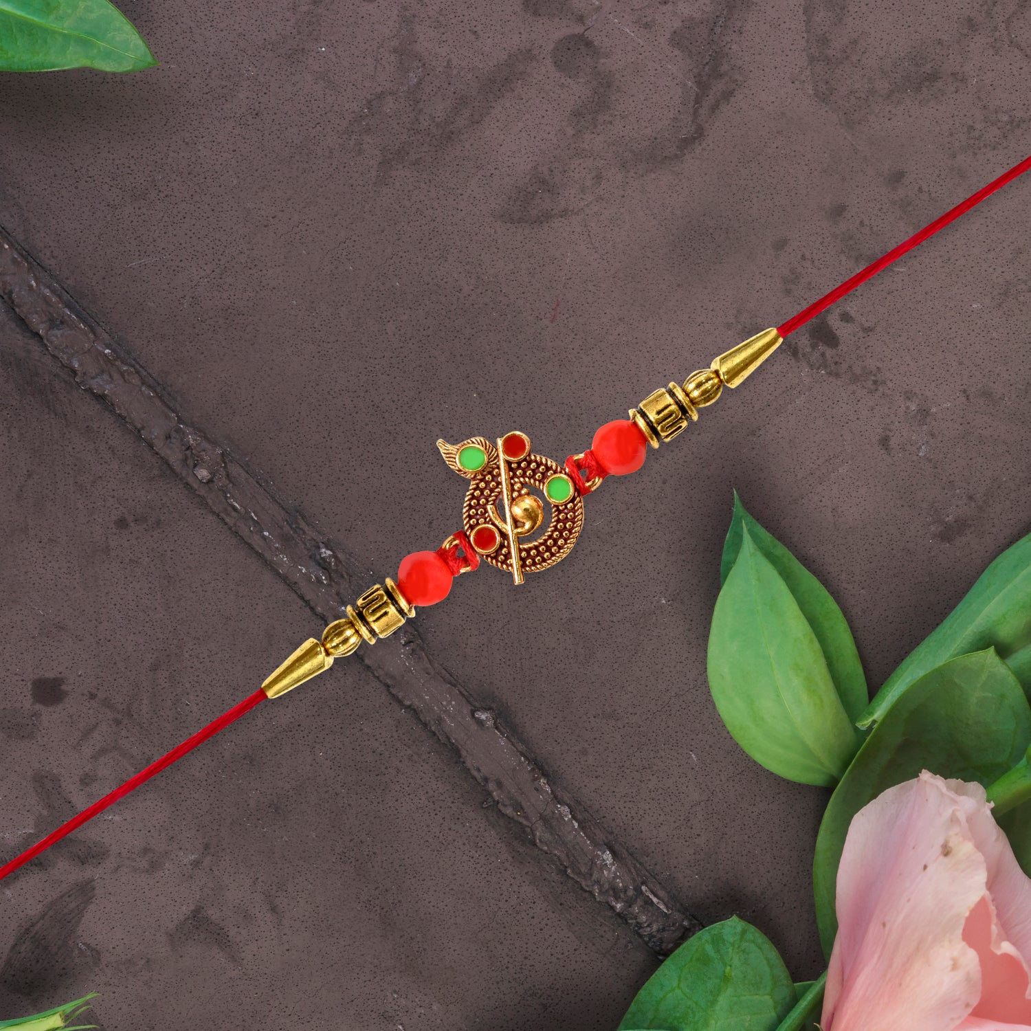 Red Beaded Rakhi With Krishna Symbol Red Beaded Rakhi With Krishna Symbol